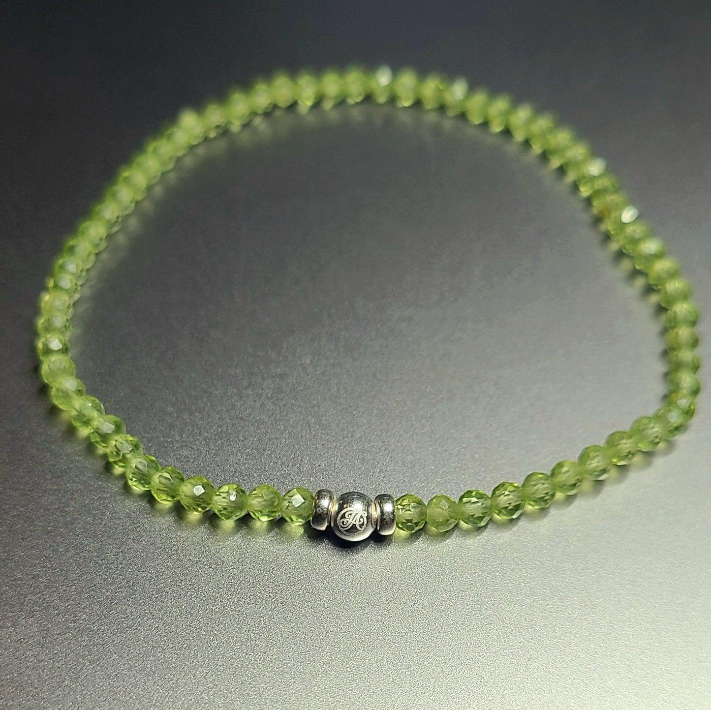 August Peridot and Sterling Silver V3 bracelet with 3 mm faceted peridot beads