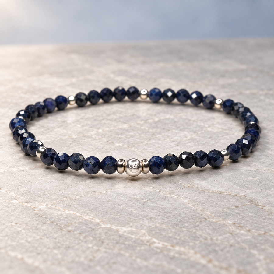 Sapphire Midnight faceted sterling silver bracelet on a neutral stone surface